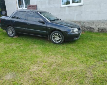 Чорний Міцубісі Харизма, об'ємом двигуна 1.6 л та пробігом 408 тис. км за 2600 $, фото 1 на Automoto.ua