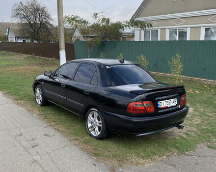 Міцубісі Харизма 2002 у Измаиле на Automoto.ua Чорний Міцубісі Харизма, об'ємом двигуна 1.6 л та пробігом 500 тис. км за 2600 $, фото 2 на Automoto.ua