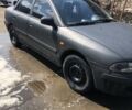 Черный Мицубиси Харизма, объемом двигателя 1.6 л и пробегом 236 тыс. км за 3000 $, фото 1 на Automoto.ua