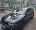 Черный Мицубиси Харизма, объемом двигателя 1.6 л и пробегом 280 тыс. км за 2600 $, фото 1 на Automoto.ua