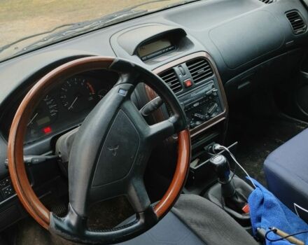 Чорний Міцубісі Харизма, об'ємом двигуна 1.6 л та пробігом 408 тис. км за 2600 $, фото 2 на Automoto.ua