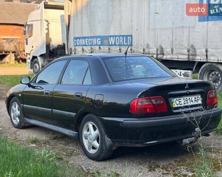 Черный Мицубиси Харизма, объемом двигателя 1.6 л и пробегом 300 тыс. км за 2300 $, фото 5 на Automoto.ua