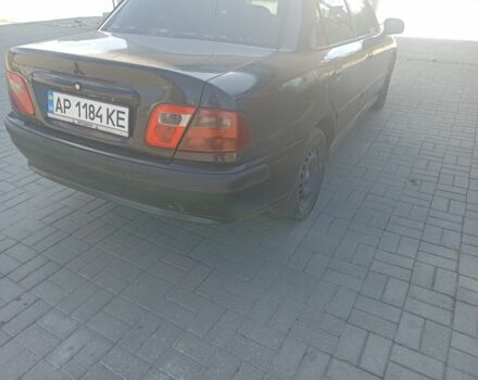 Черный Мицубиси Харизма, объемом двигателя 1.6 л и пробегом 402 тыс. км за 2200 $, фото 4 на Automoto.ua