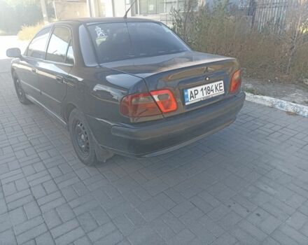 Черный Мицубиси Харизма, объемом двигателя 1.6 л и пробегом 402 тыс. км за 2200 $, фото 3 на Automoto.ua