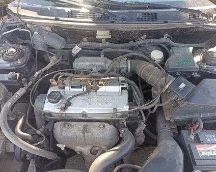 Черный Мицубиси Харизма, объемом двигателя 1.6 л и пробегом 402 тыс. км за 2200 $, фото 6 на Automoto.ua