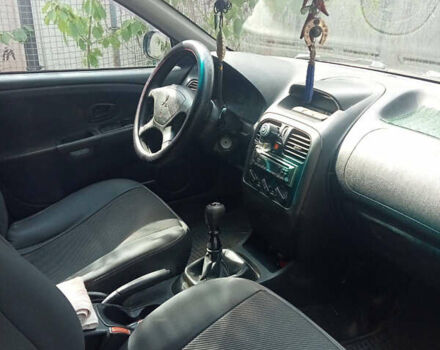 Черный Мицубиси Харизма, объемом двигателя 1.6 л и пробегом 167 тыс. км за 3100 $, фото 3 на Automoto.ua