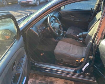 Черный Мицубиси Харизма, объемом двигателя 1.6 л и пробегом 30 тыс. км за 3000 $, фото 9 на Automoto.ua