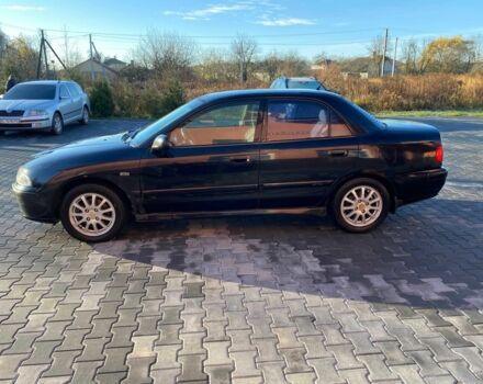 Черный Мицубиси Харизма, объемом двигателя 1.6 л и пробегом 30 тыс. км за 3000 $, фото 3 на Automoto.ua