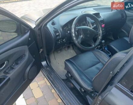 Черный Мицубиси Харизма, объемом двигателя 1.6 л и пробегом 390 тыс. км за 2700 $, фото 4 на Automoto.ua