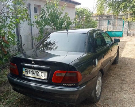 Черный Мицубиси Харизма, объемом двигателя 1.6 л и пробегом 167 тыс. км за 3100 $, фото 1 на Automoto.ua