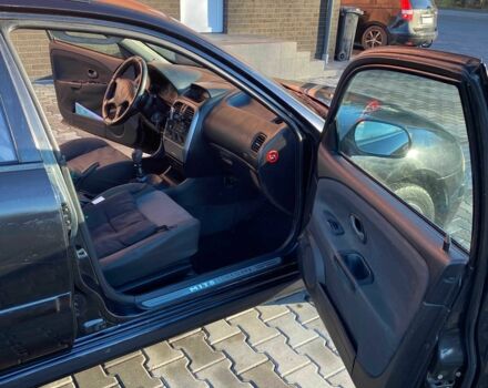 Черный Мицубиси Харизма, объемом двигателя 1.6 л и пробегом 30 тыс. км за 3000 $, фото 8 на Automoto.ua