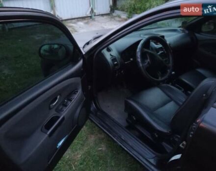 Черный Мицубиси Харизма, объемом двигателя 1.6 л и пробегом 390 тыс. км за 2700 $, фото 5 на Automoto.ua