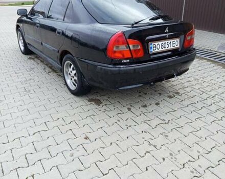 Черный Мицубиси Харизма, объемом двигателя 1.6 л и пробегом 140 тыс. км за 3500 $, фото 8 на Automoto.ua