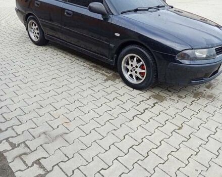 Черный Мицубиси Харизма, объемом двигателя 1.6 л и пробегом 140 тыс. км за 3500 $, фото 7 на Automoto.ua