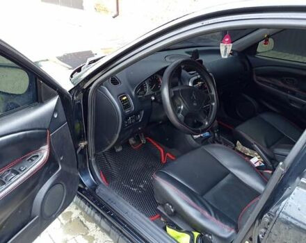 Черный Мицубиси Харизма, объемом двигателя 1.6 л и пробегом 140 тыс. км за 3500 $, фото 5 на Automoto.ua