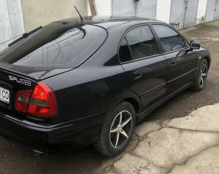 Чорний Міцубісі Харизма, об'ємом двигуна 1.6 л та пробігом 270 тис. км за 4300 $, фото 3 на Automoto.ua