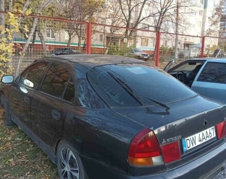 Міцубісі Харизма 1997 у Краматорске на Automoto.ua Чорний Міцубісі Харизма, об'ємом двигуна 0 л та пробігом 100 тис. км за 716 $, фото 1 на Automoto.ua
