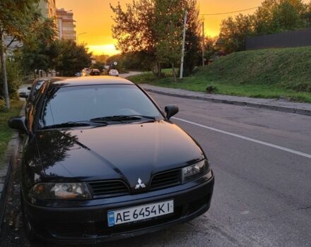 Черный Мицубиси Харизма, объемом двигателя 1.6 л и пробегом 408 тыс. км за 2600 $, фото 1 на Automoto.ua