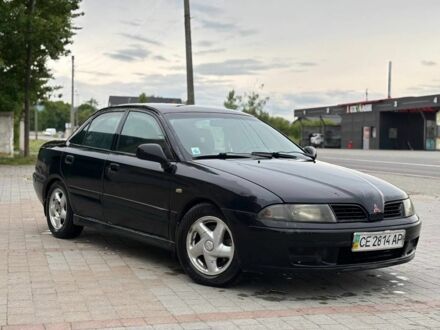 Міцубісі Харизма 2003 у Надворной на Automoto.ua Чорний Міцубісі Харизма, об'ємом двигуна 1.6 л та пробігом 300 тис. км за 2200 $, фото 1 на Automoto.ua