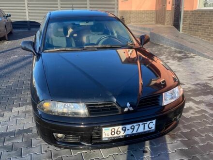 Черный Мицубиси Харизма, объемом двигателя 1.6 л и пробегом 30 тыс. км за 3000 $, фото 1 на Automoto.ua