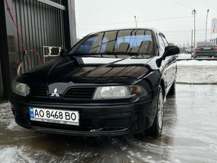 Чорний Міцубісі Харизма, об'ємом двигуна 1.6 л та пробігом 300 тис. км за 3100 $, фото 1 на Automoto.ua