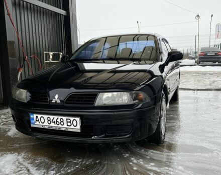 Чорний Міцубісі Харизма, об'ємом двигуна 1.6 л та пробігом 300 тис. км за 3100 $, фото 1 на Automoto.ua