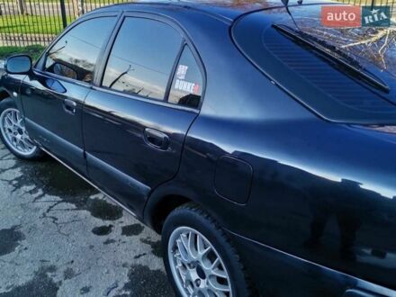 Черный Мицубиси Харизма, объемом двигателя 1.6 л и пробегом 427 тыс. км за 2500 $, фото 1 на Automoto.ua