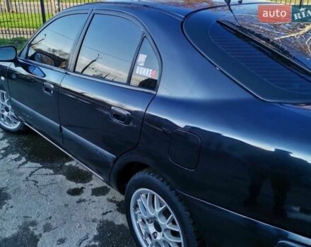 Черный Мицубиси Харизма, объемом двигателя 1.6 л и пробегом 427 тыс. км за 2500 $, фото 1 на Automoto.ua