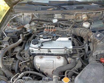 Черный Мицубиси Харизма, объемом двигателя 1.6 л и пробегом 300 тыс. км за 3100 $, фото 1 на Automoto.ua