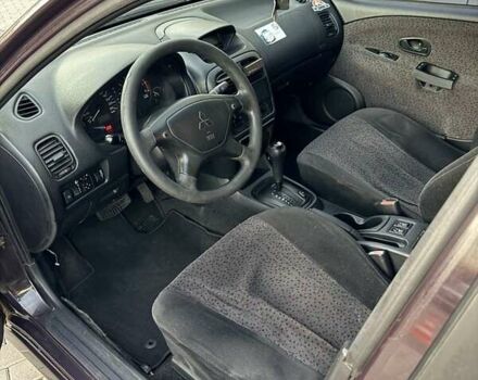 Фиолетовый Мицубиси Харизма, объемом двигателя 1.6 л и пробегом 236 тыс. км за 3000 $, фото 4 на Automoto.ua