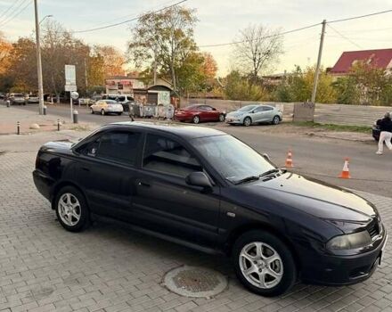 Фиолетовый Мицубиси Харизма, объемом двигателя 1.6 л и пробегом 236 тыс. км за 3000 $, фото 7 на Automoto.ua