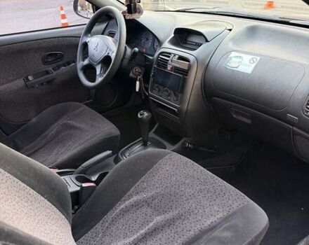 Фиолетовый Мицубиси Харизма, объемом двигателя 1.6 л и пробегом 236 тыс. км за 3000 $, фото 3 на Automoto.ua