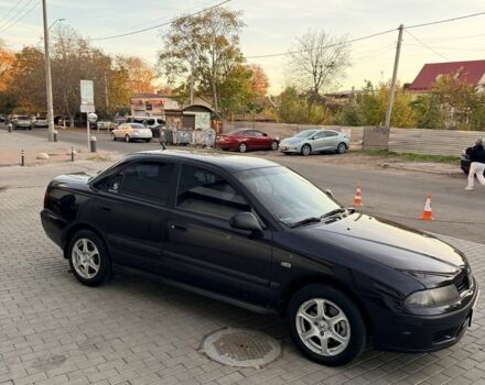 Фиолетовый Мицубиси Харизма, объемом двигателя 1.6 л и пробегом 236 тыс. км за 3000 $, фото 1 на Automoto.ua