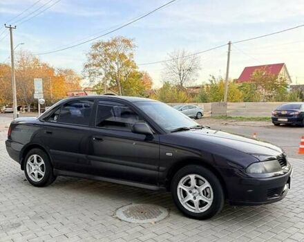 Фиолетовый Мицубиси Харизма, объемом двигателя 1.6 л и пробегом 236 тыс. км за 3000 $, фото 1 на Automoto.ua