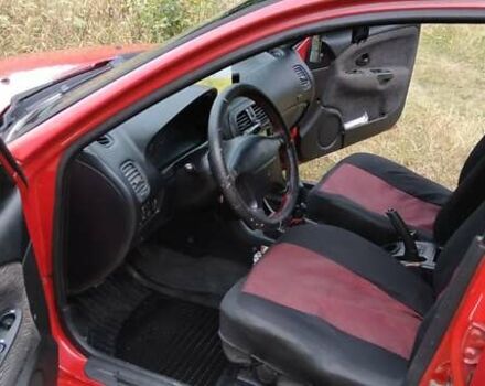 Красный Мицубиси Харизма, объемом двигателя 1.6 л и пробегом 367 тыс. км за 3200 $, фото 8 на Automoto.ua