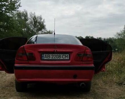 Красный Мицубиси Харизма, объемом двигателя 1.6 л и пробегом 367 тыс. км за 3200 $, фото 1 на Automoto.ua