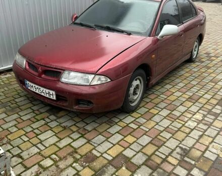 Красный Мицубиси Харизма, объемом двигателя 1.8 л и пробегом 200 тыс. км за 800 $, фото 5 на Automoto.ua