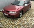 Красный Мицубиси Харизма, объемом двигателя 1.8 л и пробегом 200 тыс. км за 800 $, фото 5 на Automoto.ua