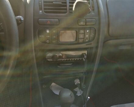 Красный Мицубиси Харизма, объемом двигателя 1.8 л и пробегом 327 тыс. км за 2700 $, фото 8 на Automoto.ua