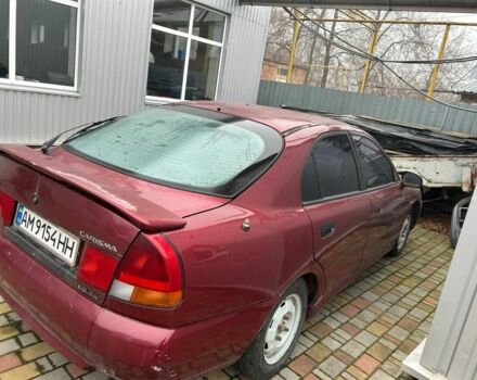 Красный Мицубиси Харизма, объемом двигателя 1.8 л и пробегом 200 тыс. км за 800 $, фото 3 на Automoto.ua