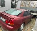 Красный Мицубиси Харизма, объемом двигателя 1.8 л и пробегом 200 тыс. км за 800 $, фото 3 на Automoto.ua