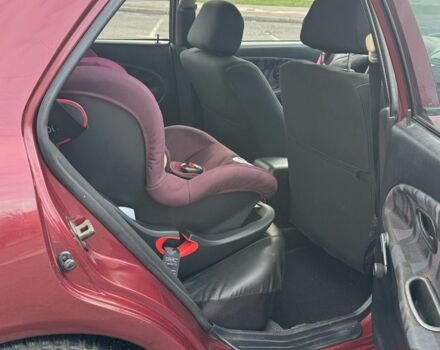 Красный Мицубиси Харизма, объемом двигателя 1.8 л и пробегом 257 тыс. км за 3100 $, фото 8 на Automoto.ua