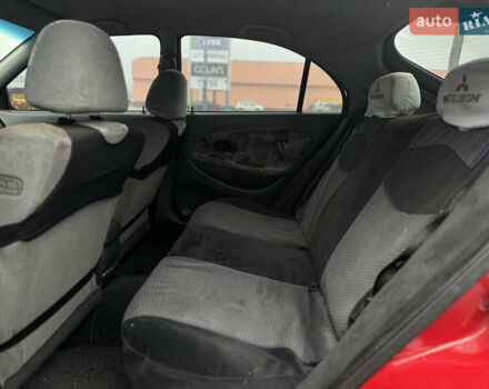 Красный Мицубиси Харизма, объемом двигателя 1.84 л и пробегом 172 тыс. км за 2990 $, фото 9 на Automoto.ua