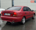 Красный Мицубиси Харизма, объемом двигателя 1.84 л и пробегом 172 тыс. км за 2990 $, фото 4 на Automoto.ua