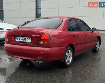 Красный Мицубиси Харизма, объемом двигателя 1.84 л и пробегом 140 тыс. км за 3400 $, фото 4 на Automoto.ua