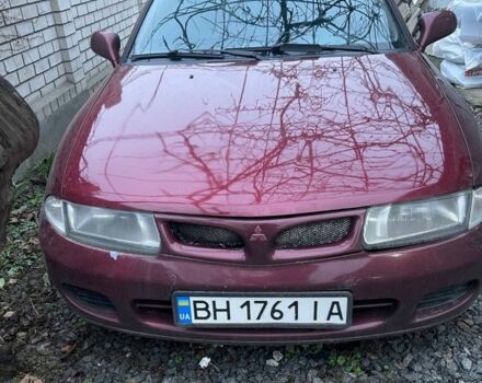 Красный Мицубиси Харизма, объемом двигателя 1.6 л и пробегом 306 тыс. км за 1500 $, фото 1 на Automoto.ua