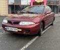 Красный Мицубиси Харизма, объемом двигателя 1.8 л и пробегом 257 тыс. км за 3100 $, фото 1 на Automoto.ua