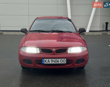 Красный Мицубиси Харизма, объемом двигателя 1.84 л и пробегом 172 тыс. км за 2990 $, фото 1 на Automoto.ua