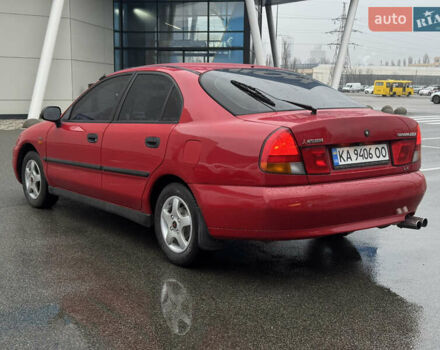 Красный Мицубиси Харизма, объемом двигателя 1.84 л и пробегом 172 тыс. км за 2990 $, фото 5 на Automoto.ua