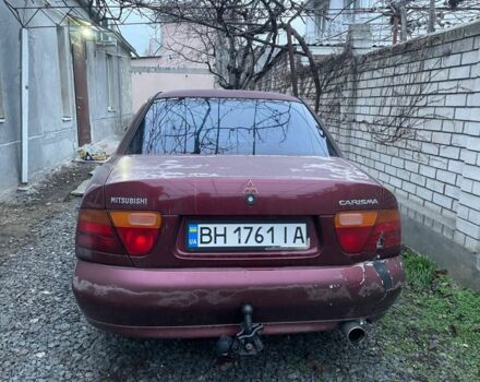 Красный Мицубиси Харизма, объемом двигателя 1.6 л и пробегом 306 тыс. км за 1500 $, фото 4 на Automoto.ua